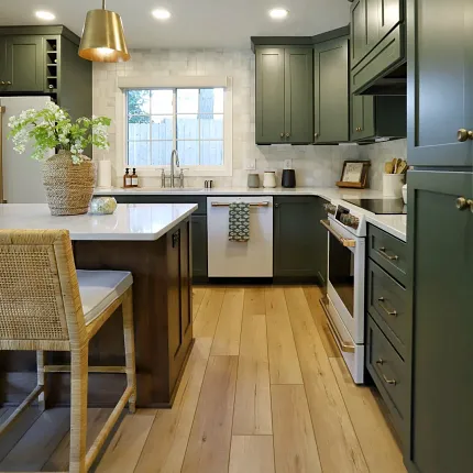 Coretec Residential WPC Luxury Vinyl Plank Flooring in Modern Kitchen kitchen with green cabinets and luxury vinyl plank floor in a wood look