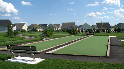 Bocce ball court with scenic neighborhood view Outdoor bocce ball court in a residential neighborhood