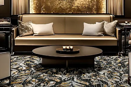 Sophisticated hospitality interior design with plush carpet and chic decor Luxurious hospitality lounge with elegant seating and patterned carpet