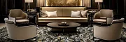 Sophisticated hospitality interior design with plush carpet and chic decor Luxurious hospitality lounge with elegant seating and patterned carpet