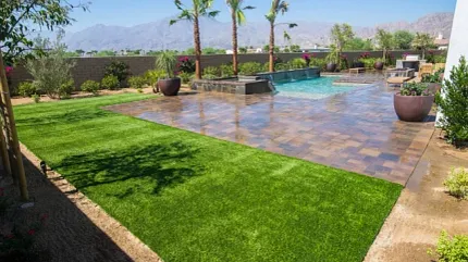 Stylish backyard with synthetic turf and pool area Outdoor patio with artificial grass and pool