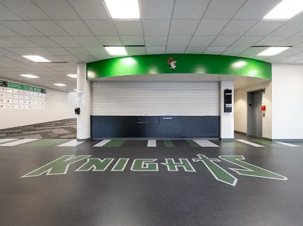 Durable LVT flooring for educational spaces Education facility with heavy commercial luxury vinyl tile flooring featuring "Knights" logo
