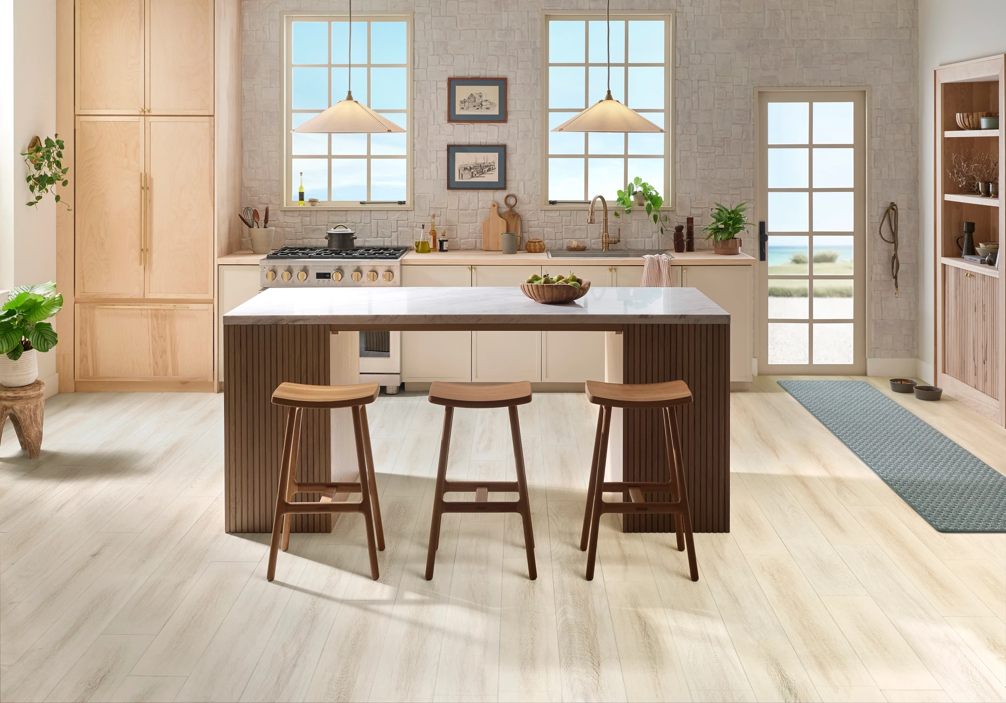 Modern kitchen with light hardwood flooring