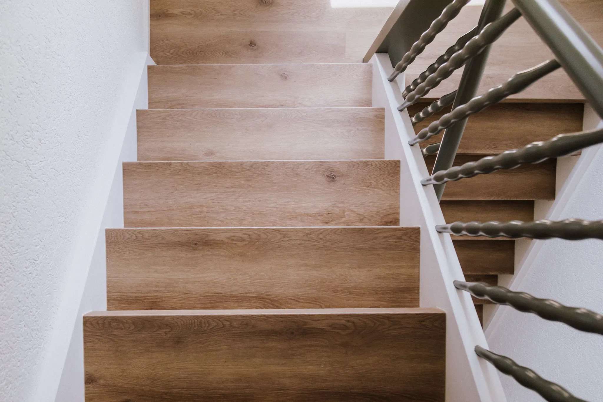 Wooden staircase with Coretec floors