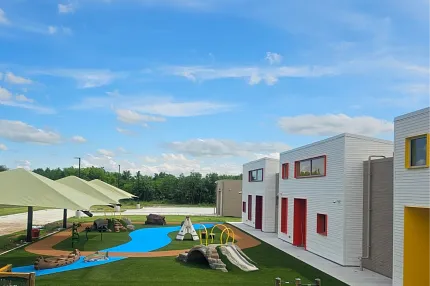 Vibrant playground design with synthetic turf and play equipment Modern outdoor playground with colorful structures and artificial grass