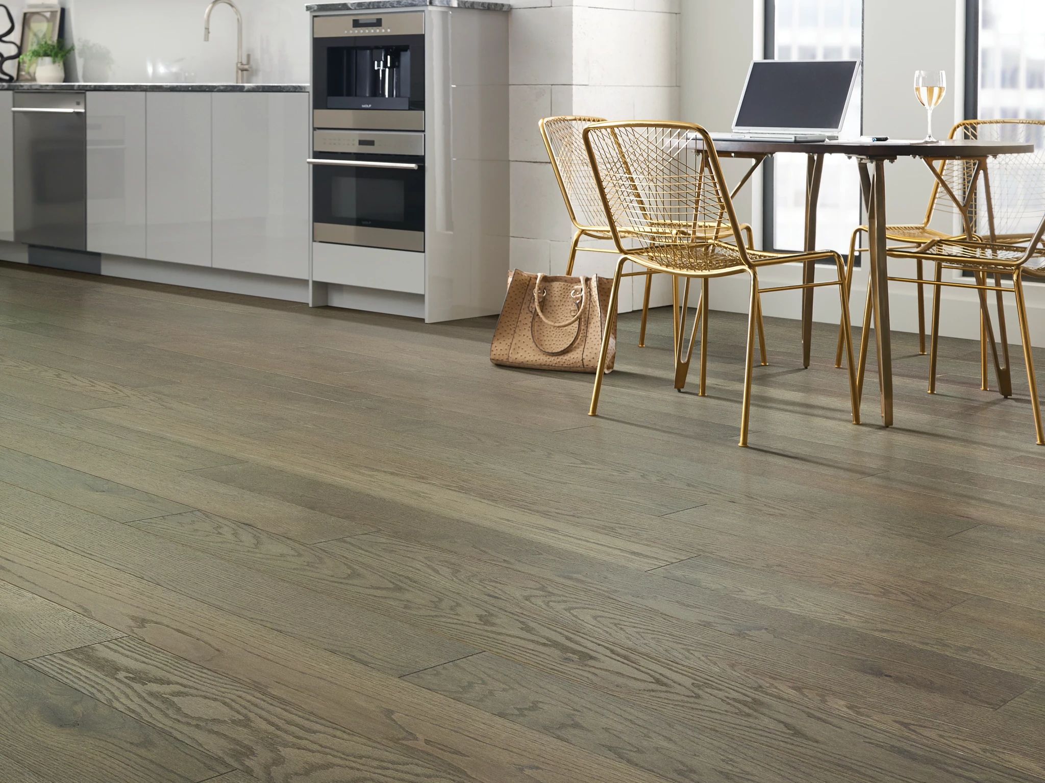 Modern kitchen with engineered hardwood flooring featuring a natural wood grain finish
