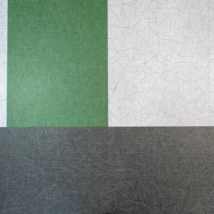Durable LVT flooring in 48x12 inch dimensions for versatile applications Swatch of heavy commercial luxury vinyl tile in green, light gray, and dark gray colors