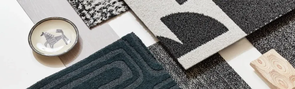Assorted carpet swatches in black, white, and dark teal