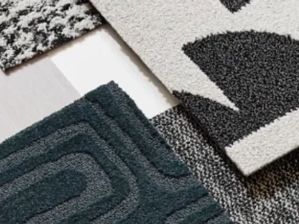 Stylish carpet designs for modern interiors Assorted carpet swatches in black, white, and dark teal