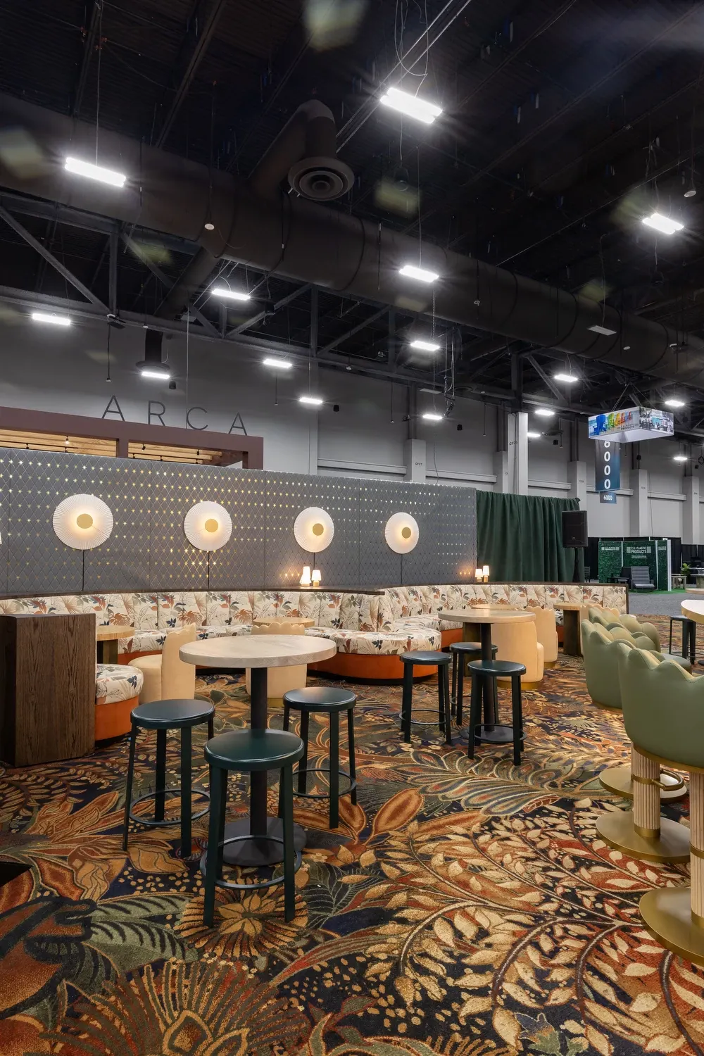 Vibrant floral commercial carpet in hospitality lounge setting