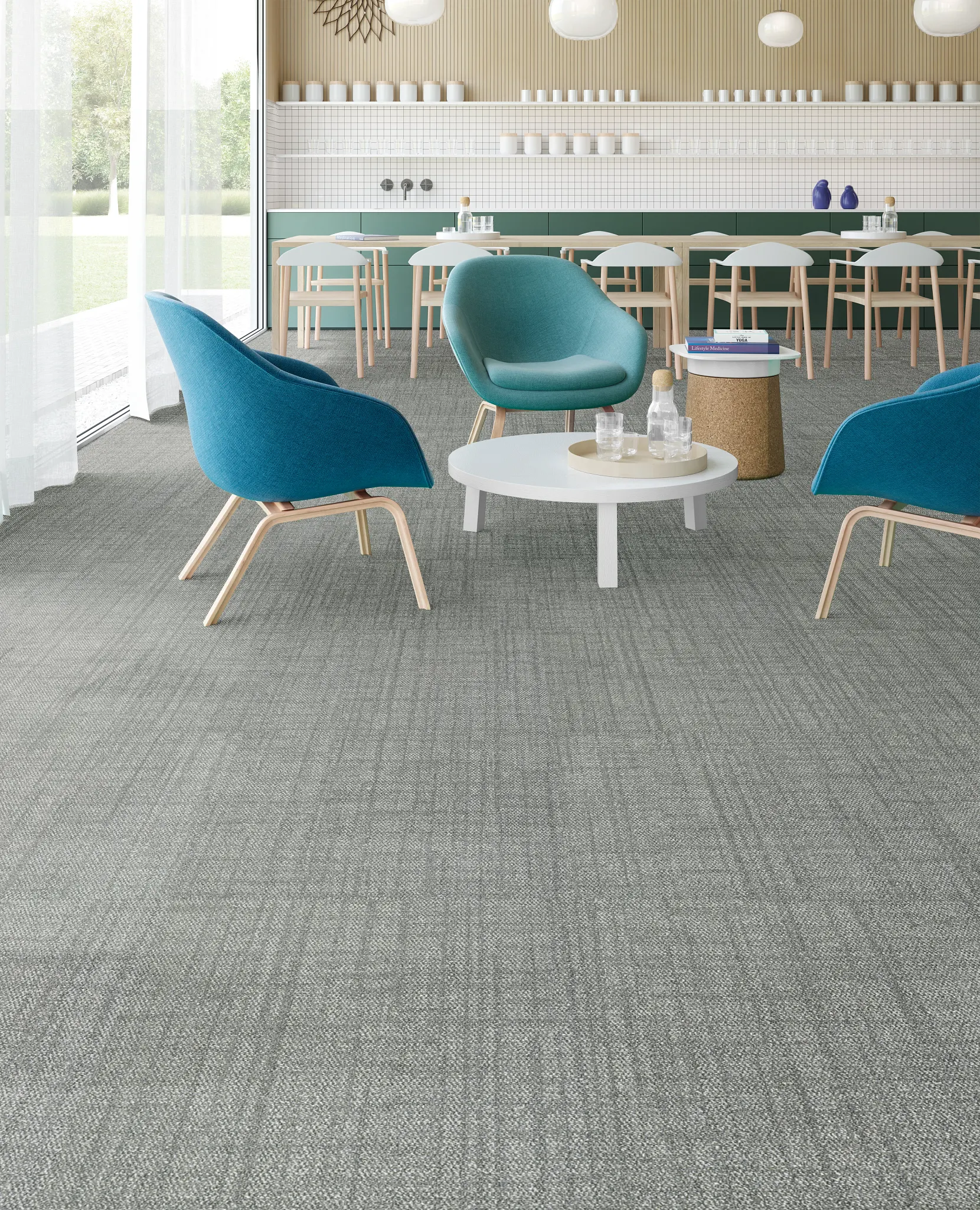 Modern lounge area with blue chairs and white tables on gray commercial carpet tile, 24x24 inch