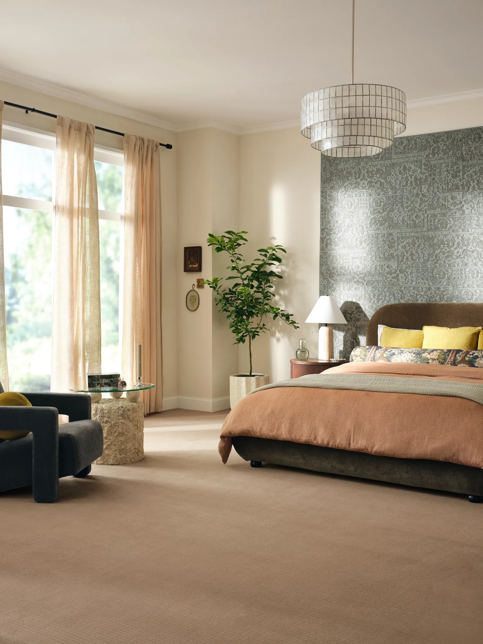 Cozy bedroom with beige carpet flooring and modern decor