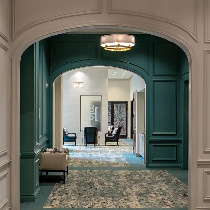 Stylish flooring design for sophisticated interiors Elegant hallway with patterned carpet and checkered tile flooring