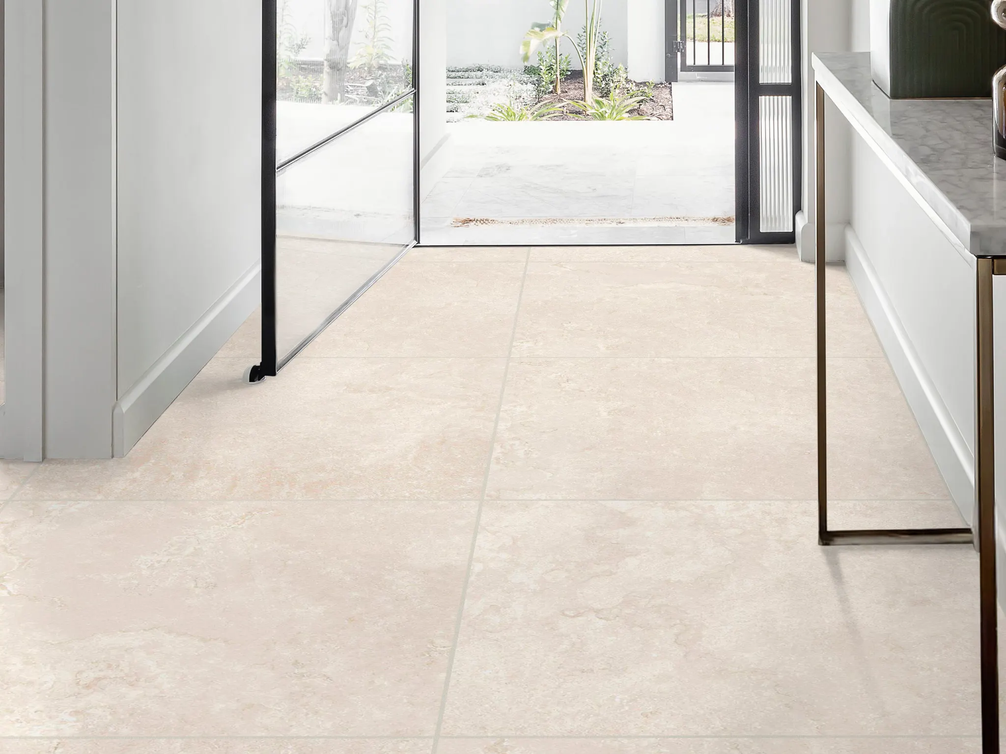 Elegant beige tile flooring in a modern, sunlit entryway