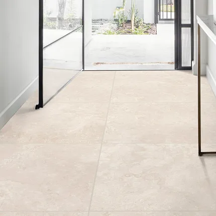 Durable and easy-to-maintain beige tile flooring for a welcoming home atmosphere Elegant beige tile flooring in a modern, sunlit entryway
