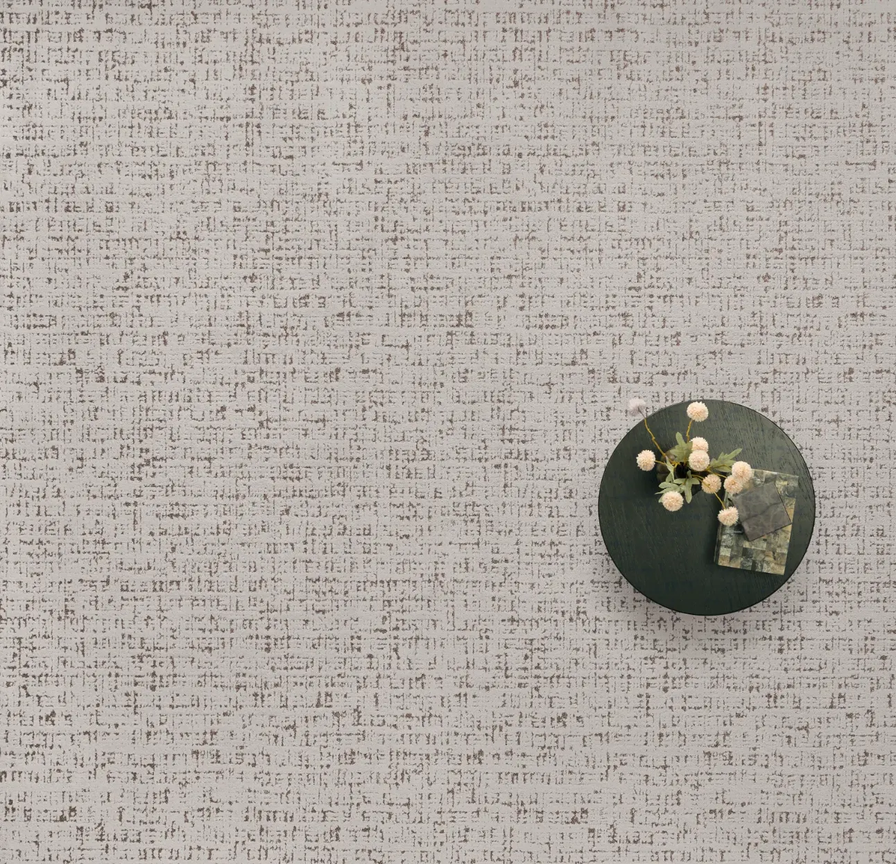 Soft surface flooring with subtle pattern and decorative table