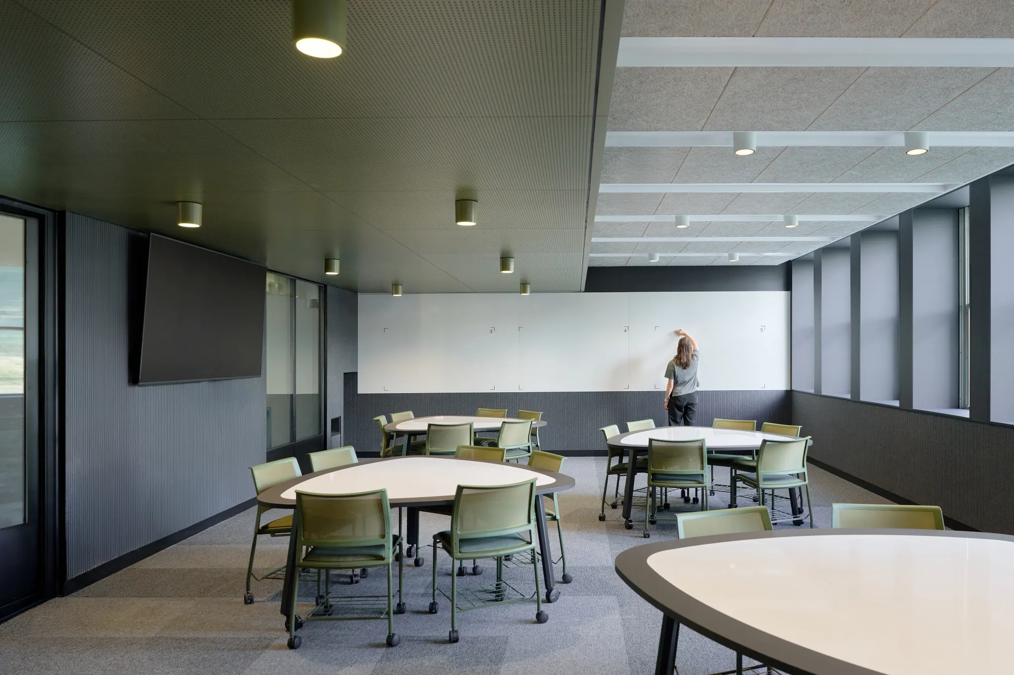 Flexible teaching and collaboration space at Monash University Clayton Menzies Building Level 1 Teaching Space Upgrades by Hayball, featuring mobile learning tables, integrated technology and adaptable educational environments.