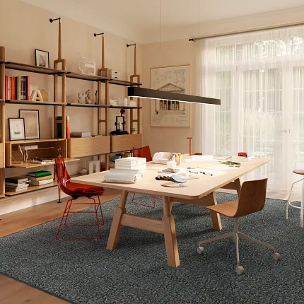 Gray Patterned Carpet with Textured Design Next to Green Chair Gray patterned carpet with a textured design next to a green metal chair on a tiled floor