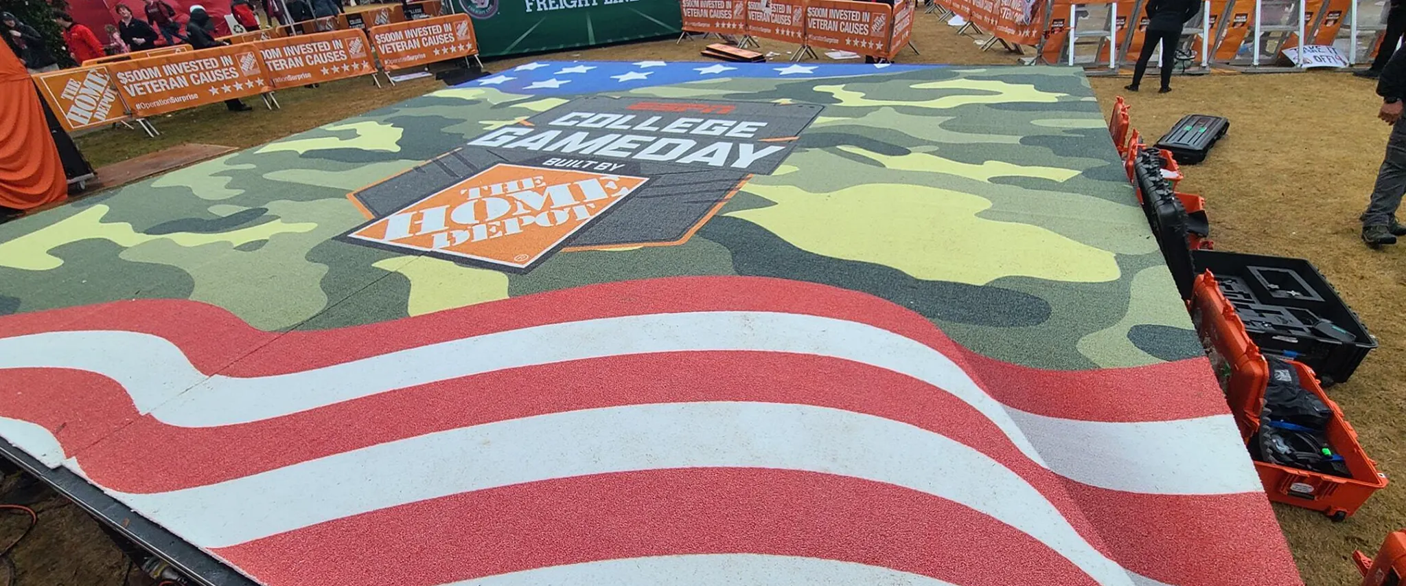 College Gameday event flooring with camouflage and flag design