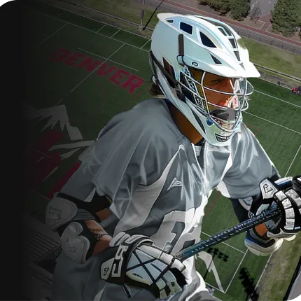 Young athlete in sports gear with lacrosse stick Young athlete in sports gear holding a lacrosse stick