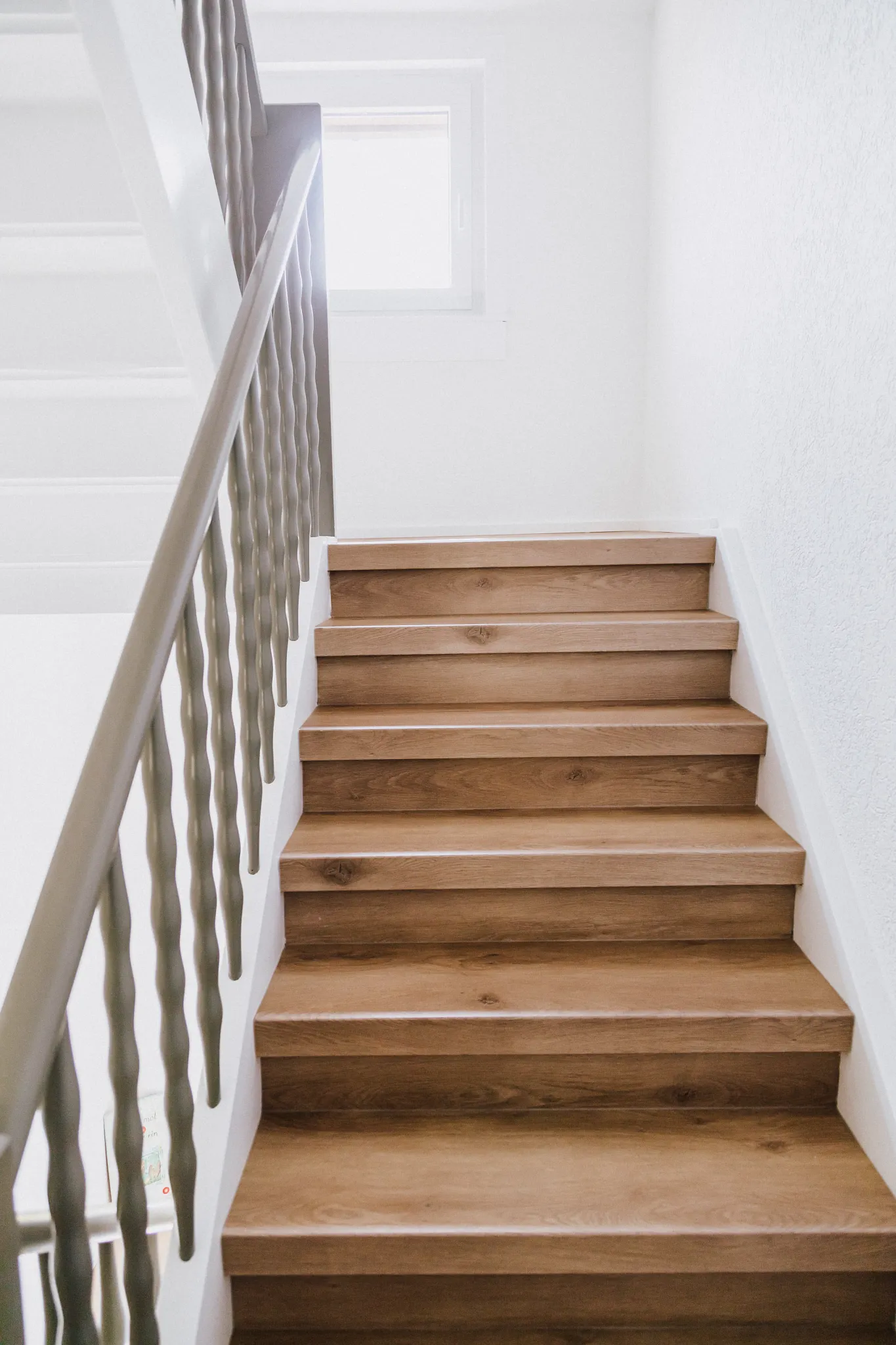 Wooden staircase with Coretec floors