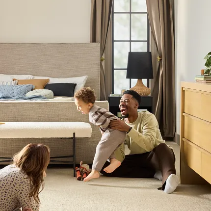 Beige Carpet Flooring for Comfortable and Inviting Home Spaces family room with beige carpet floor showcasing a warm and inviting atmosphere with a family enjoying quality time together