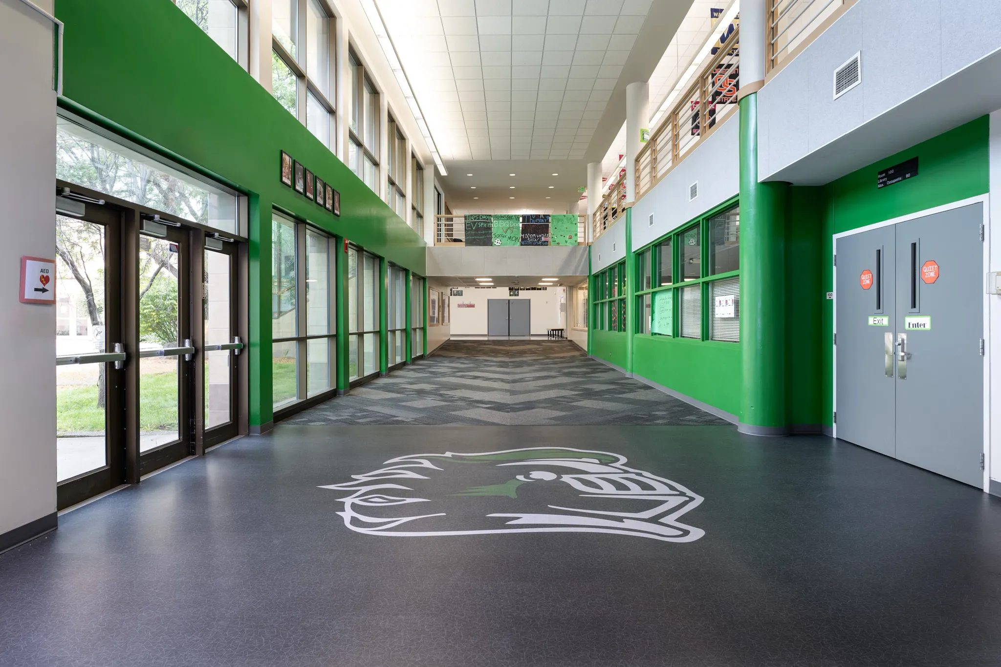 Heavy commercial luxury vinyl tile flooring in an education facility hallway