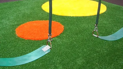 Vibrant playground turf for outdoor play areas Playground with artificial grass and colorful circles