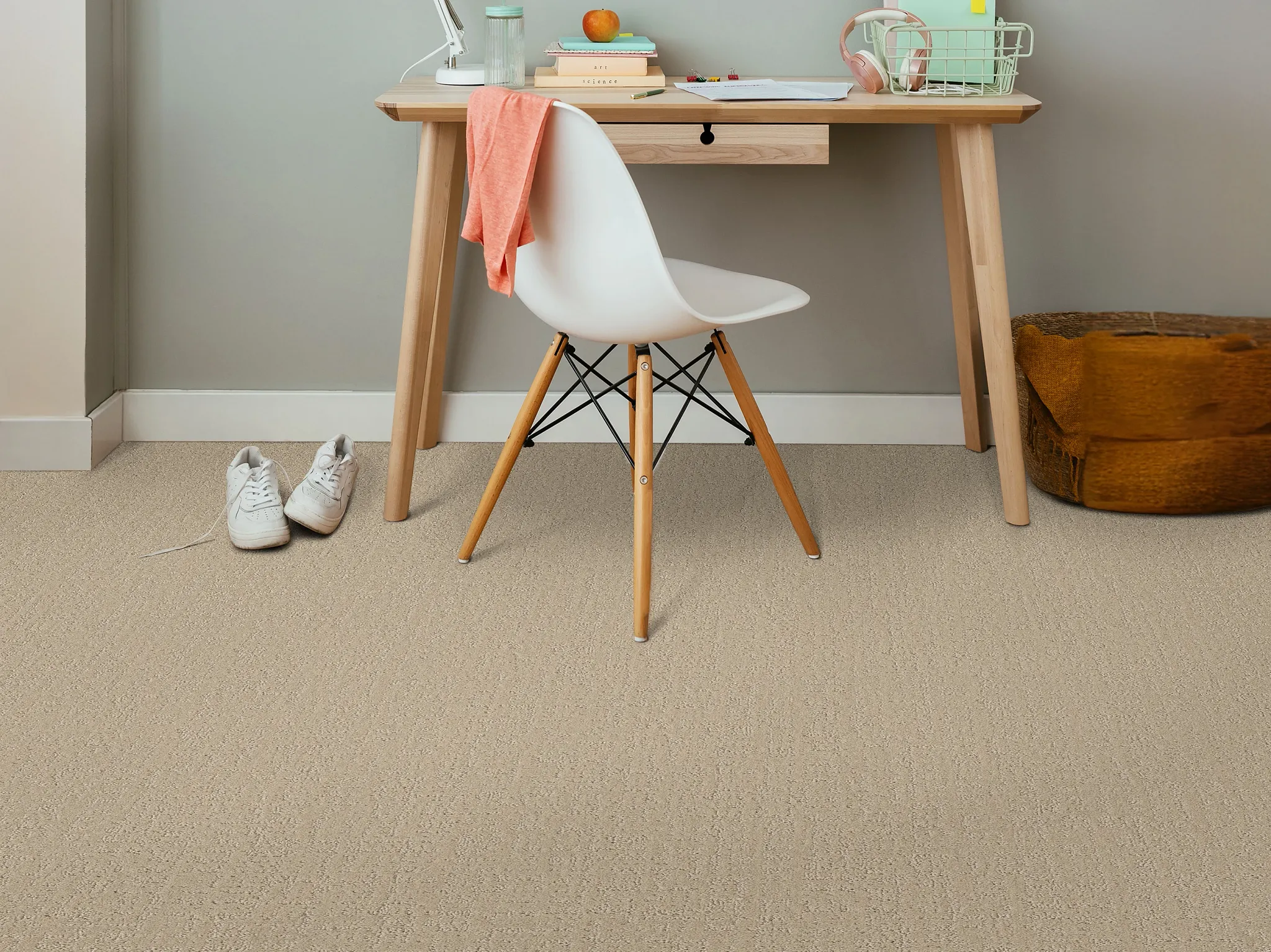 Cozy home office with beige carpet flooring