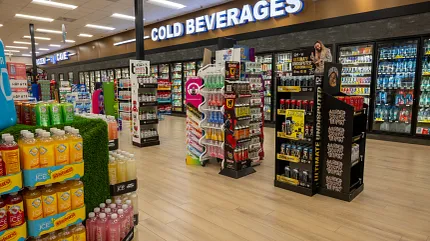 Durable Rigid Mineral Core flooring 47.55x5.66 inch for commercial spaces Rigid Core flooring in a beverage aisle with cold drinks display