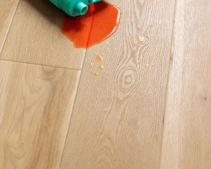 Light Wood Look LVP Flooring with Pet Accessories - Durable and Waterproof Light wood look luxury vinyl plank flooring with pet food bowls and toys scattered