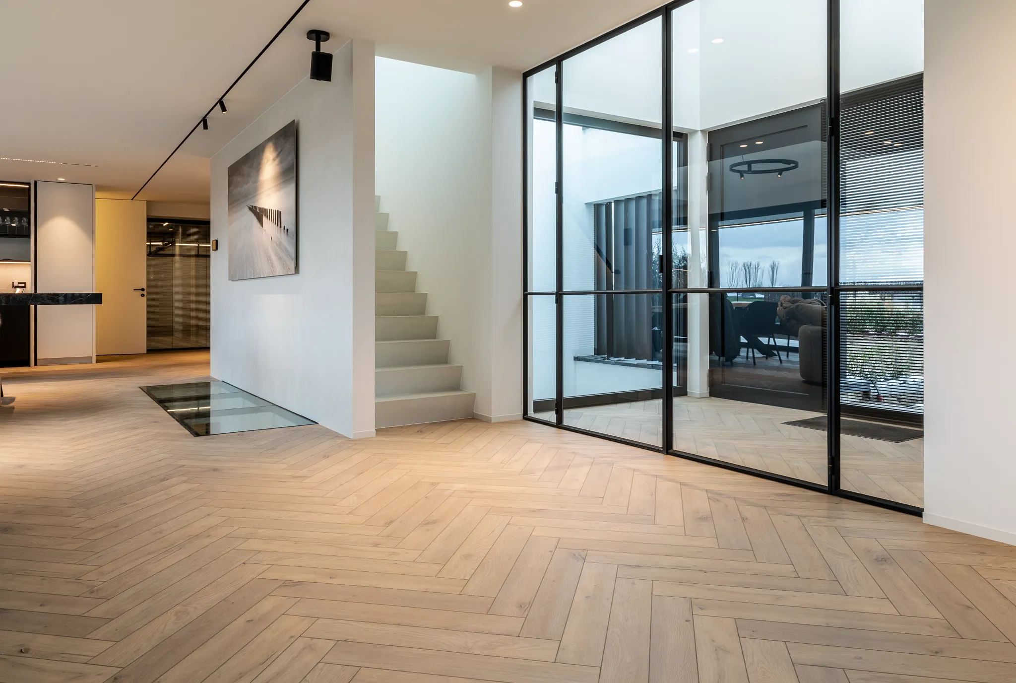 Modern living room with herringbone wood flooring