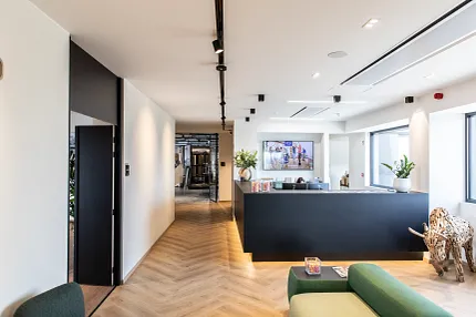 Herringbone Pattern LVP Flooring in Office Reception Area Modern office reception area with herringbone pattern luxury vinyl plank flooring