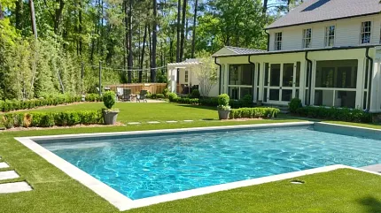 Premium outdoor artificial turf for elegant landscapes Luxurious backyard with artificial grass and swimming pool