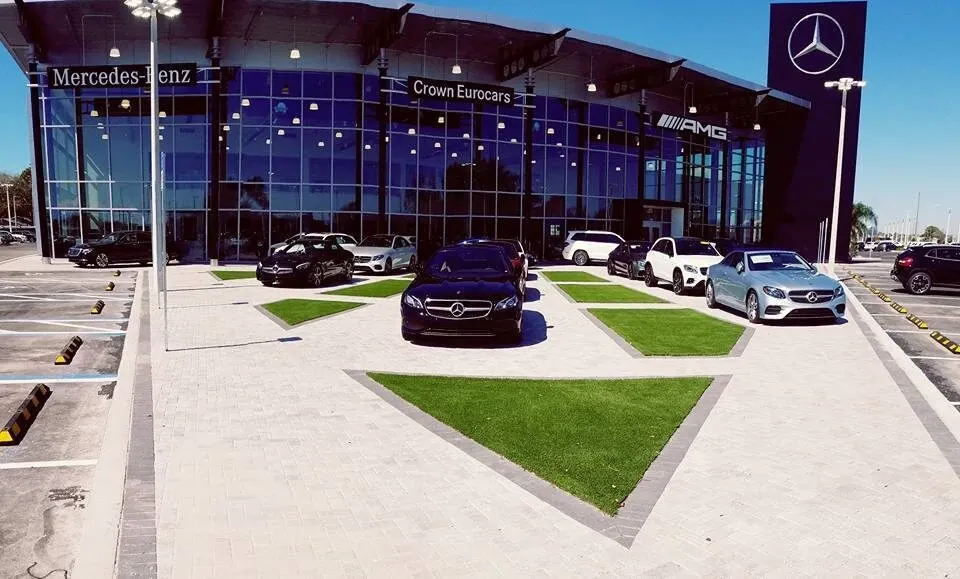 Mercedes-Benz dealership with cars displayed outside