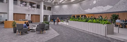 Contemporary Workplace Lobby with Grey Commercial Carpet Flooring Modern workplace lobby with high ceilings, contemporary lighting, and grey commercial carpet flooring
