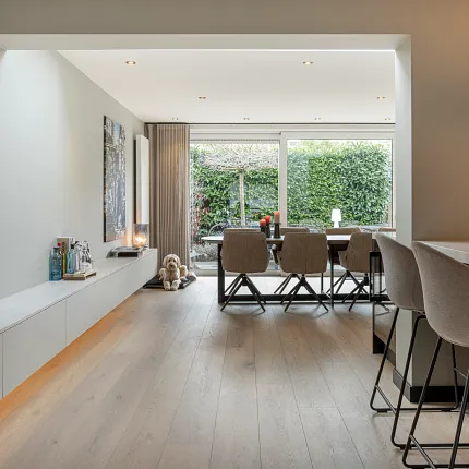 Stylish light wood flooring for contemporary home interiors Modern living room with light wood flooring and dining area