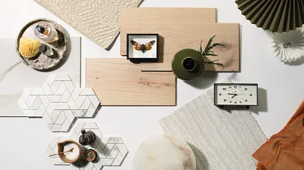 Versatile Flooring Options for Everyday Comfort and Style Assorted flooring swatches including beige carpet, light wood planks, and white hexagonal tiles with geometric patterns