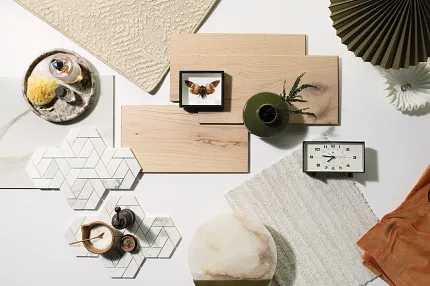 Versatile Flooring Options for Everyday Comfort and Style Assorted flooring swatches including beige carpet, light wood planks, and white hexagonal tiles with geometric patterns