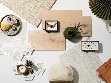 Versatile Flooring Options for Everyday Comfort and Style Assorted flooring swatches including beige carpet, light wood planks, and white hexagonal tiles with geometric patterns