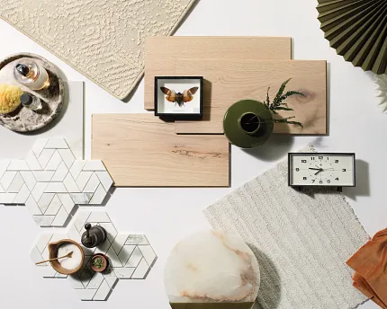 Versatile Flooring Options for Everyday Comfort and Style Assorted flooring swatches including beige carpet, light wood planks, and white hexagonal tiles with geometric patterns