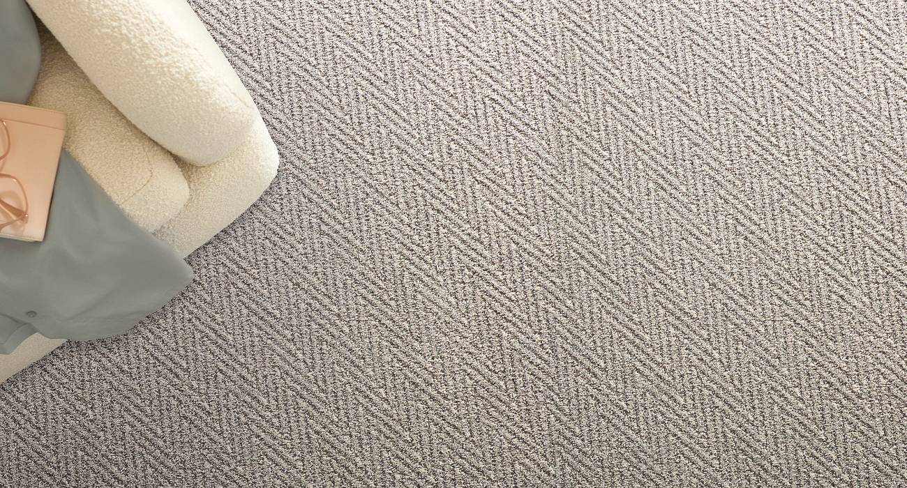 Pulling inspiration from the detailed leaves of fractal ferns, Kit offers a structured touch with the repetition of a subtle, calming pattern. The durable fibers in this Pet Perfect™ carpet offer buil