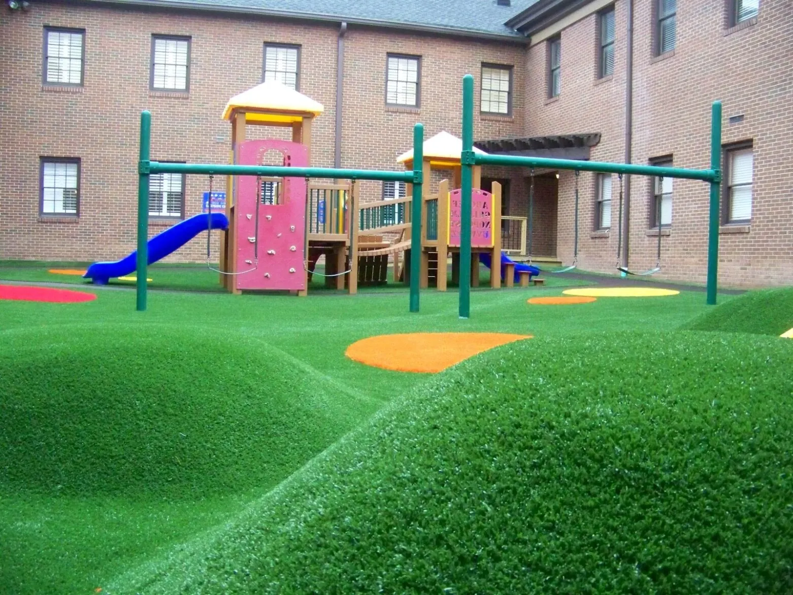 Playground with artificial grass and play structures