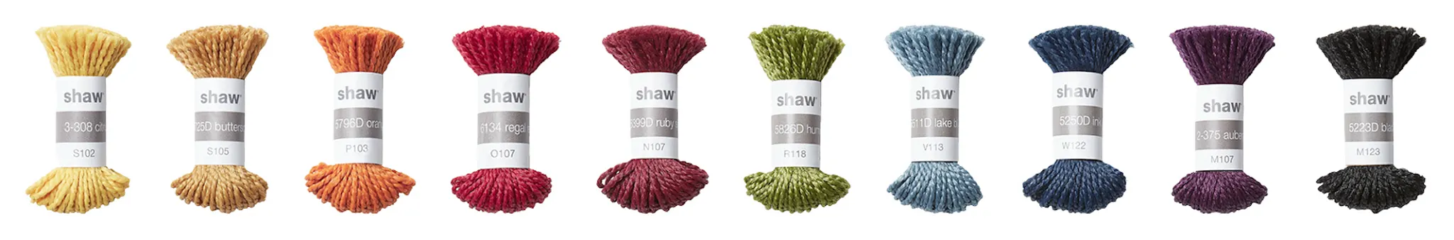 Shaw carpet samples in yellow, orange, red, green, blue, purple, and black