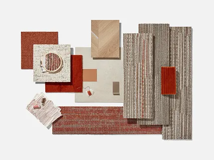 Flooring swatch collection featuring commercial carpet tiles and wood patterns in red, beige, and brown tones Assorted flooring swatches including commercial carpet tiles and wood patterns in shades of red, beige, and brown