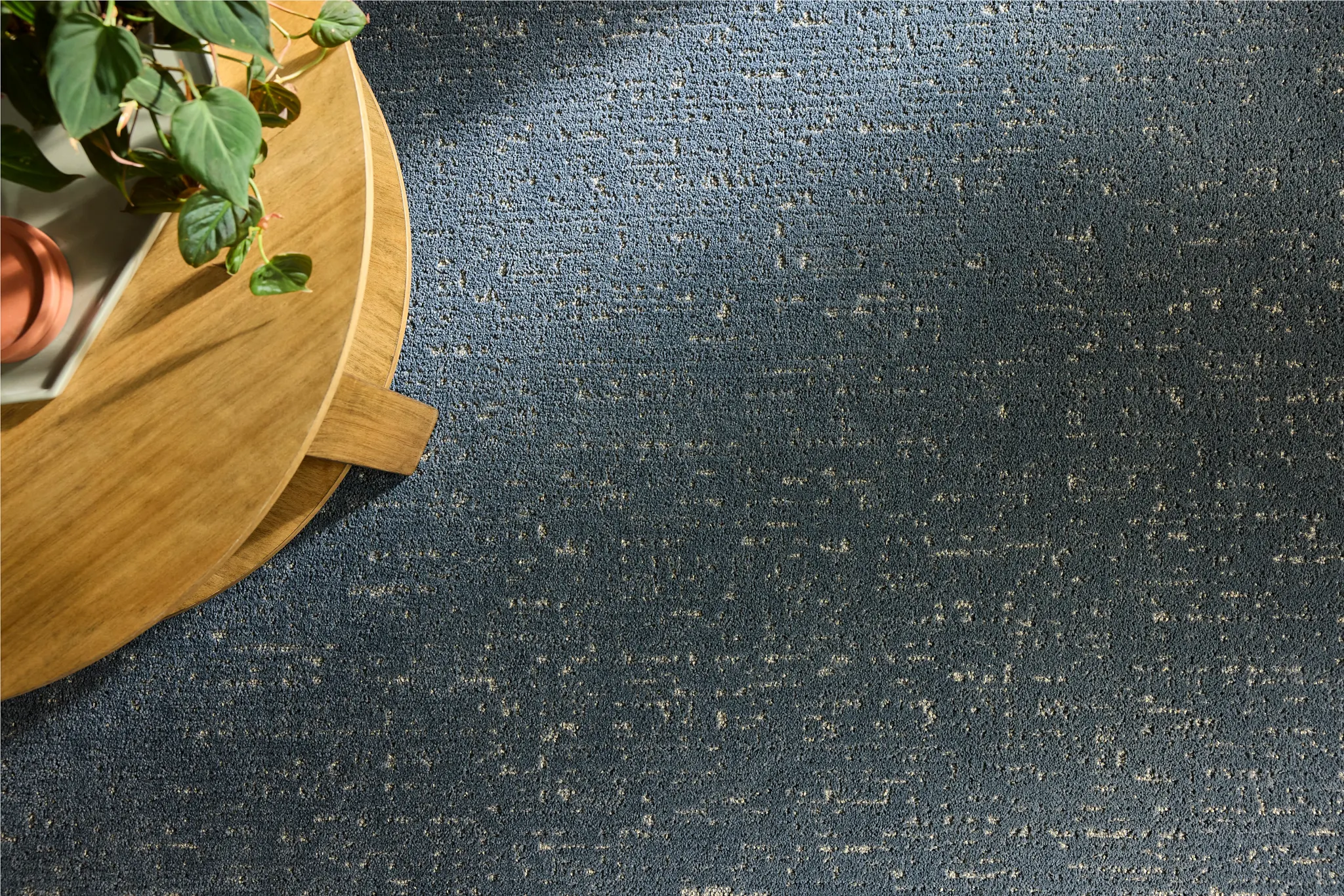 Cozy children's playroom with durable grey carpet flooring and wooden table set