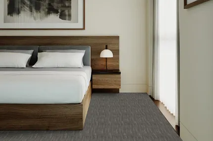 Contemporary bedroom design with gray flooring and wooden furniture Modern bedroom with a wooden bed frame, white bedding, and gray flooring
