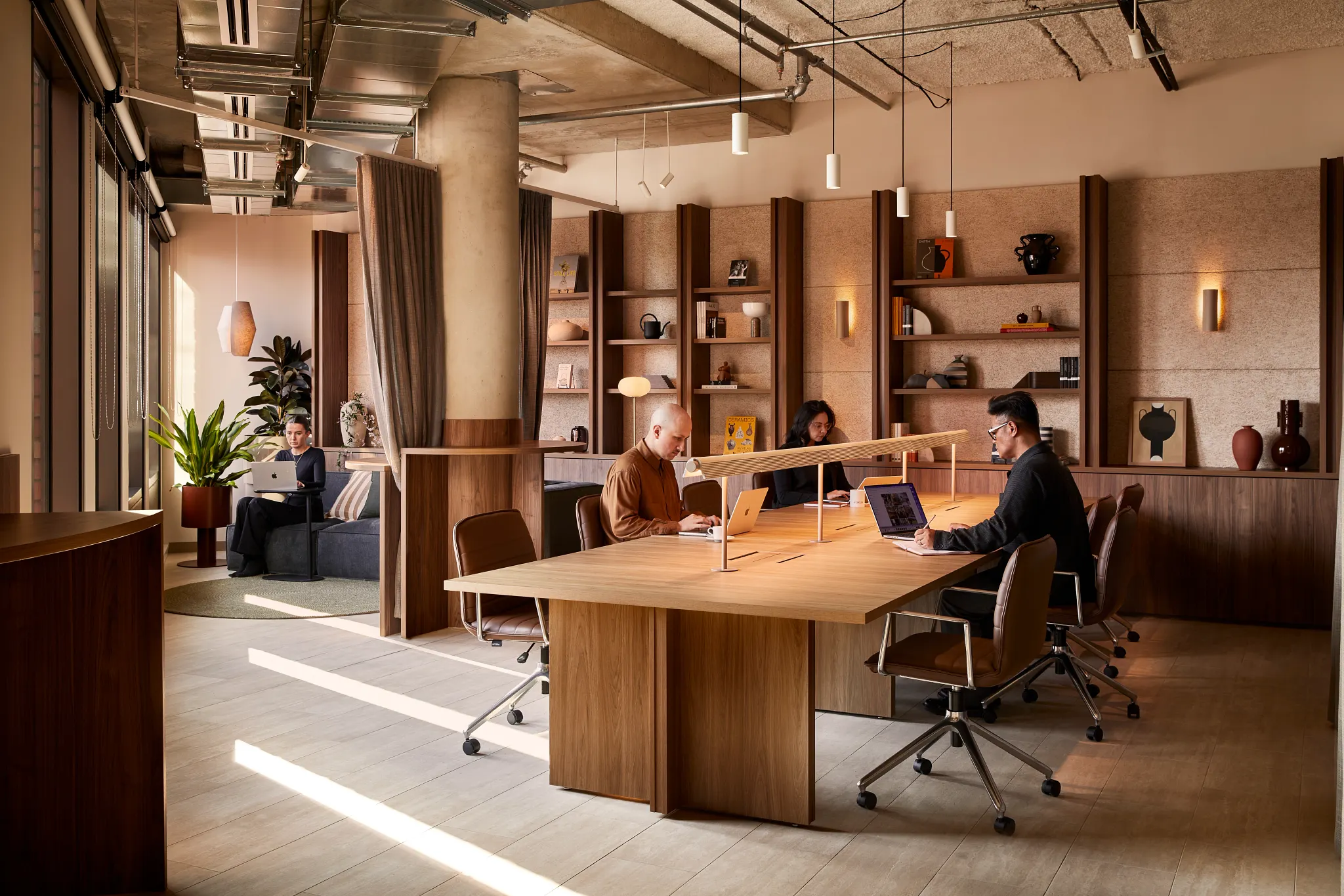 Modern office space with wooden furniture and light flooring
