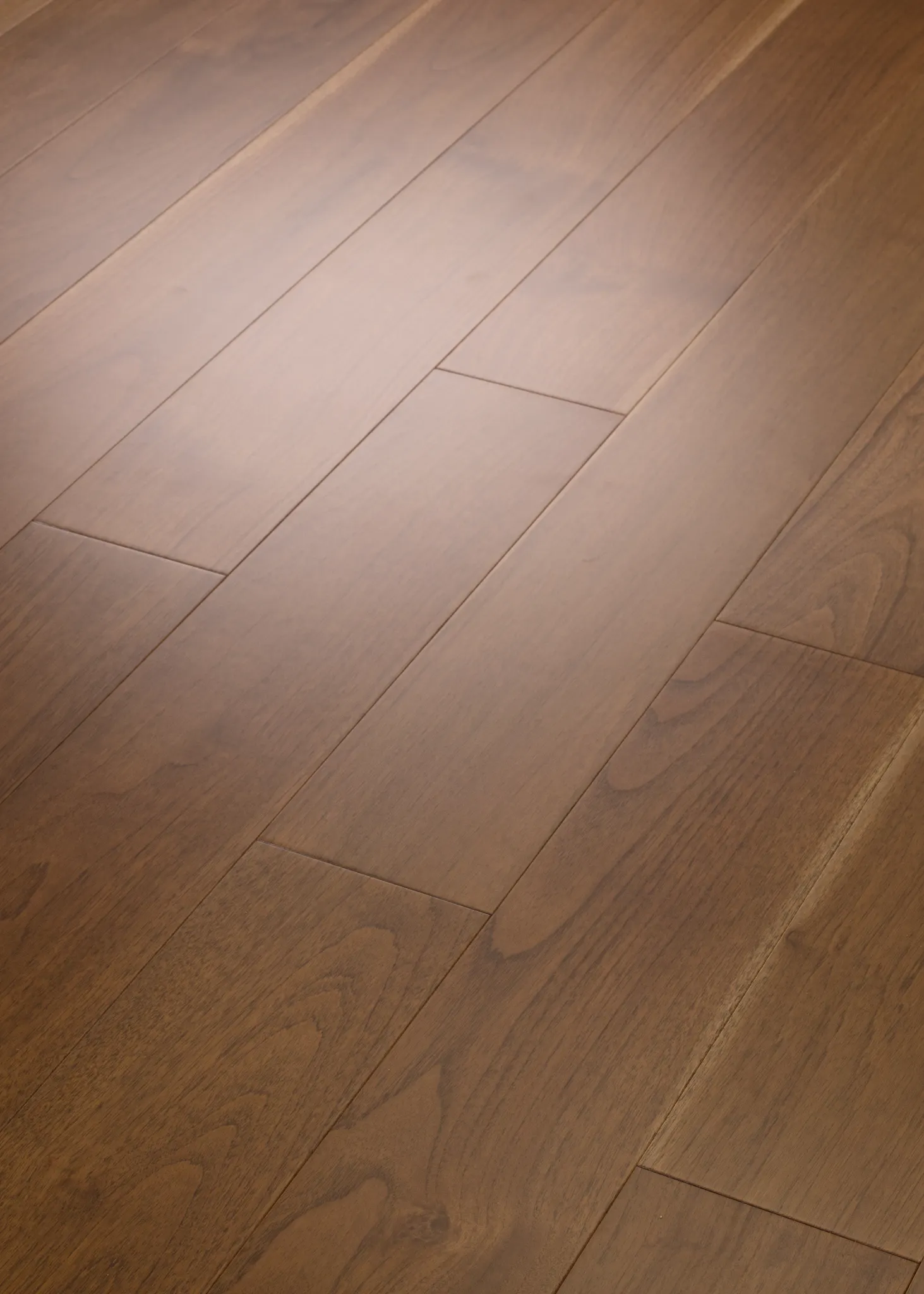 Close-up view of brown hardwood flooring with natural wood grain texture