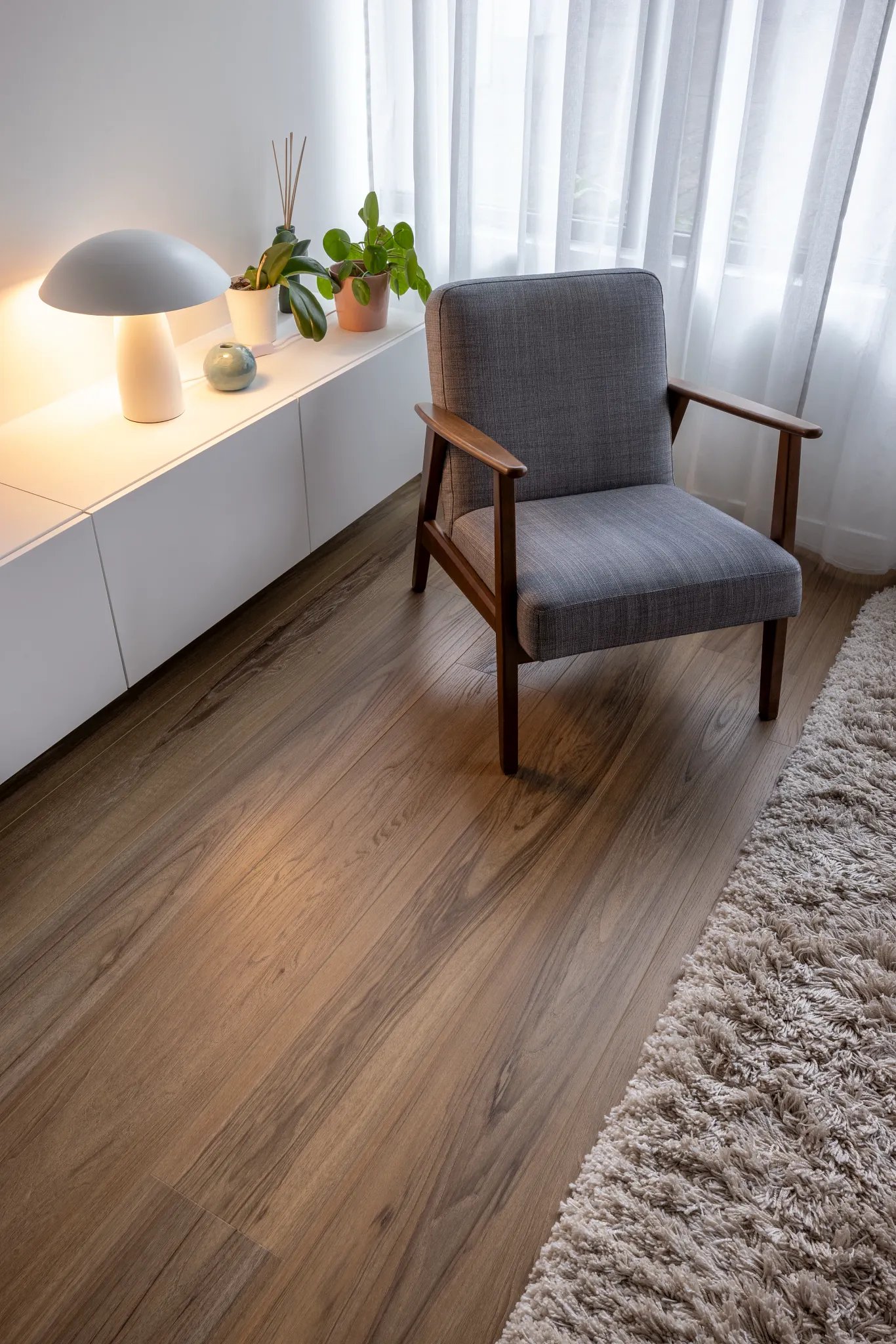 Wood oak look luxury vinyl plank floor shade dark brown in industrial home